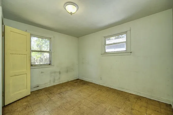 an empty room with windows