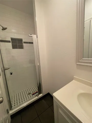 a kitchen with stainless steel appliances granite countertop a stove and a refrigerator