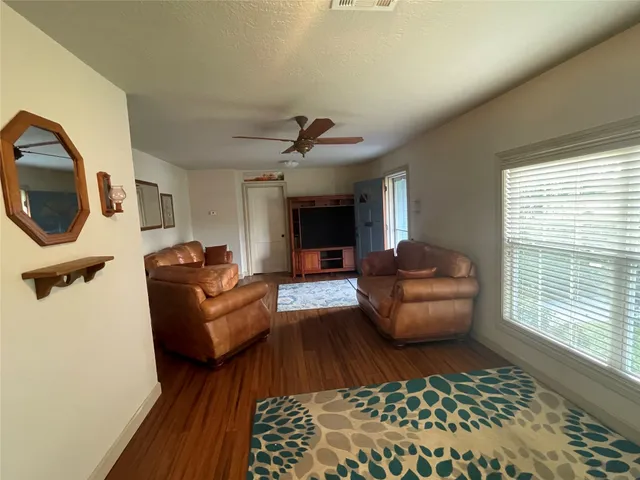 a bathroom with a sink a toilet and a shower