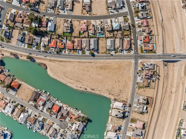 an aerial view of a city with an ocean
