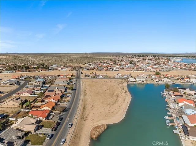 an aerial view of a city with ocean view