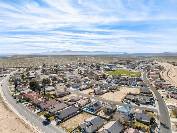 an aerial view of residential building with parking space