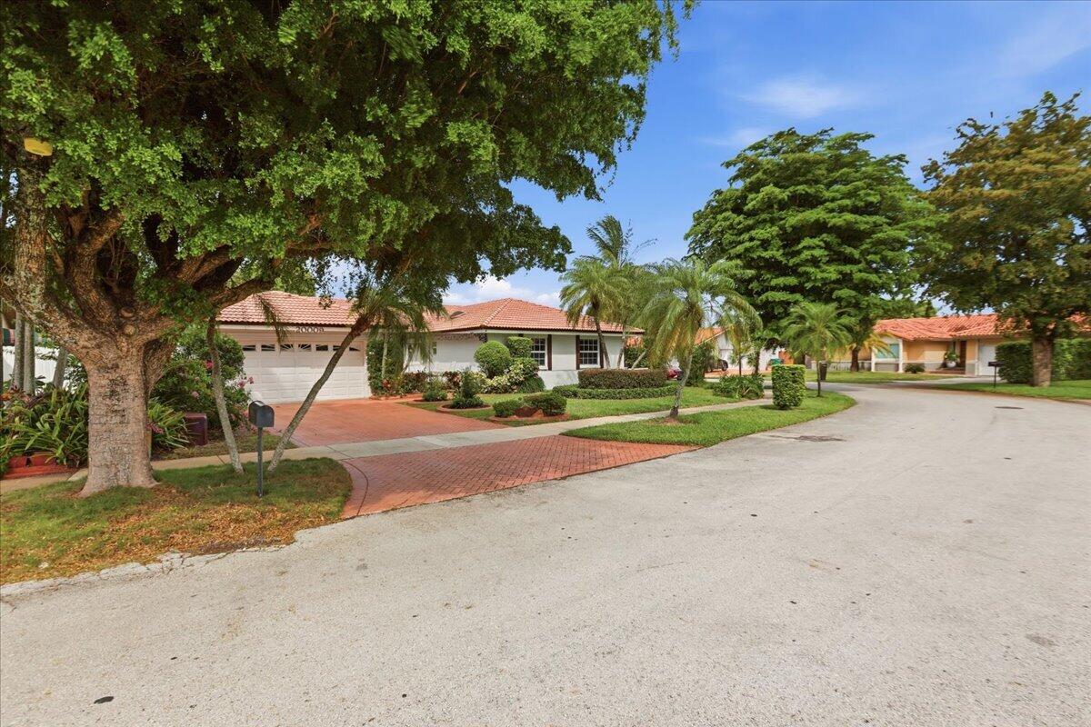 20009 Northwest 66th Place Hialeah, FL 33015 - Photo 2 of 33 a view of a street with houses on both side