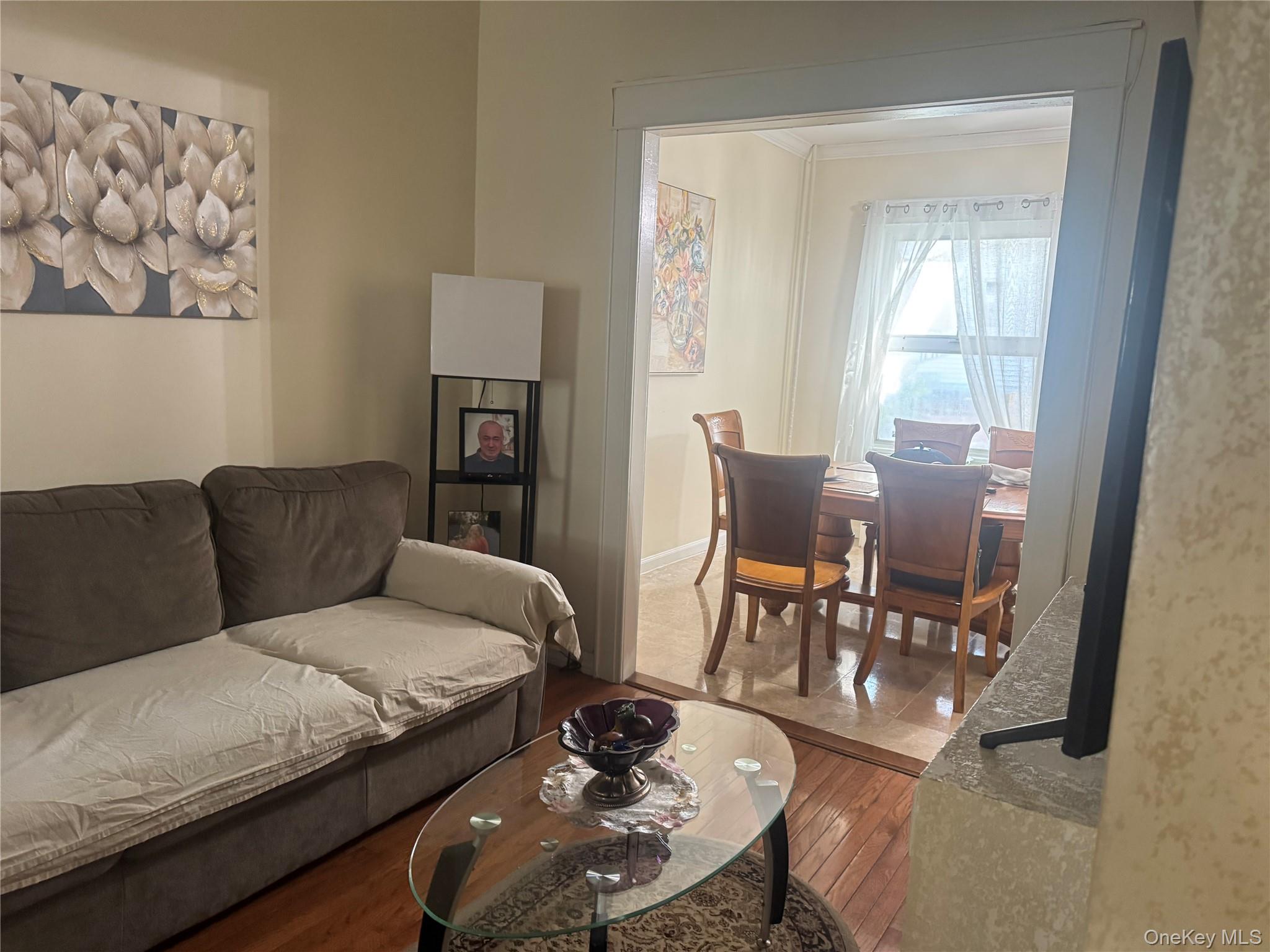 80-58 88th Road Queens, NY 11421 - Photo 5 of 21 a living room with furniture and wooden floor