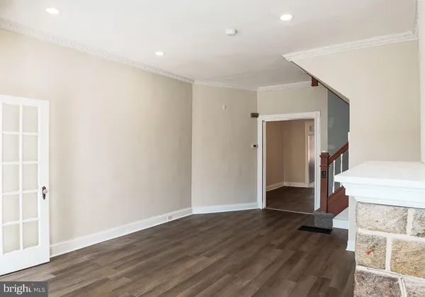 a view of entryway with wooden floor and stairs