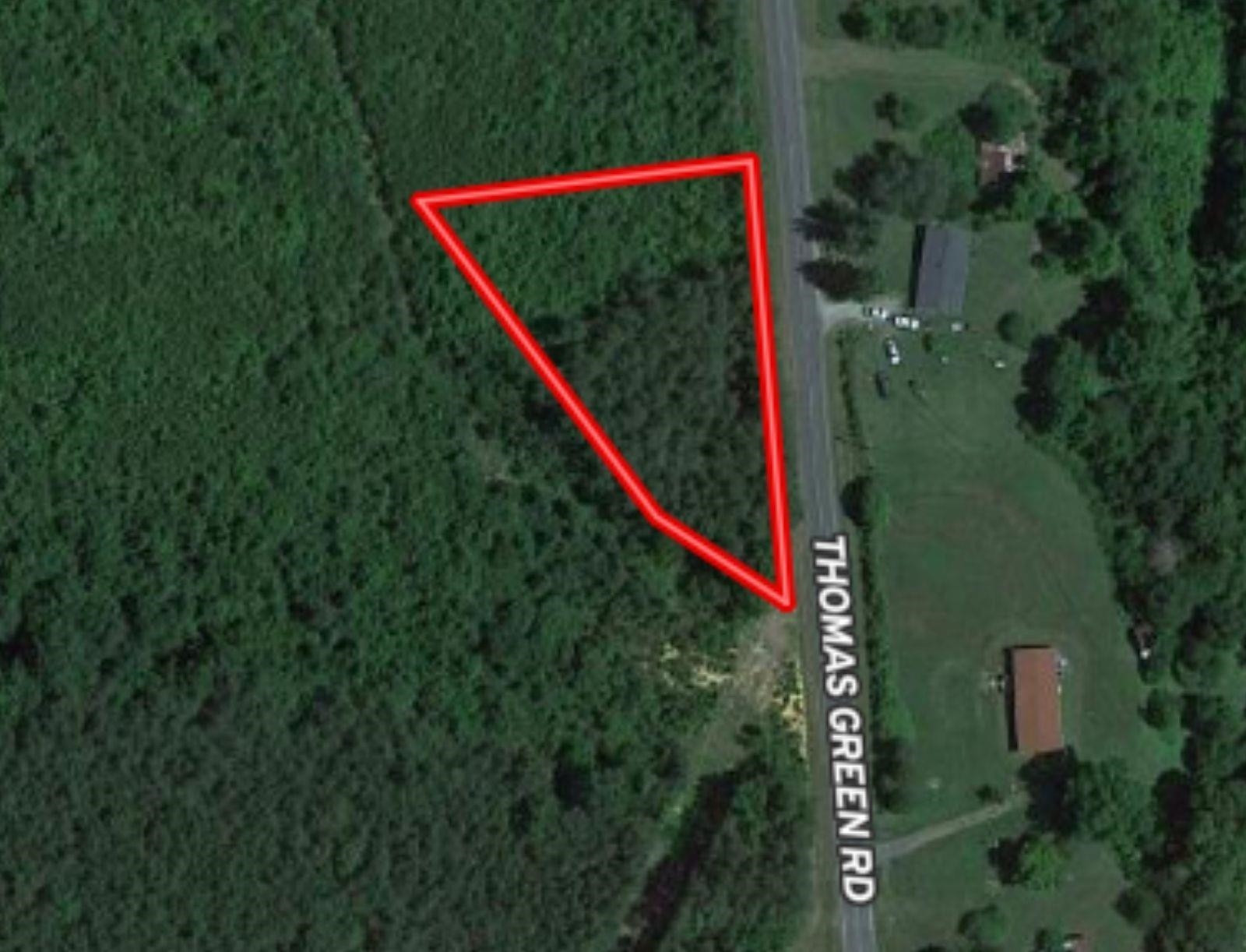 Thomas Green Road Roxboro, NC 27574 - Photo 1 of 4 a view of a backyard of a house