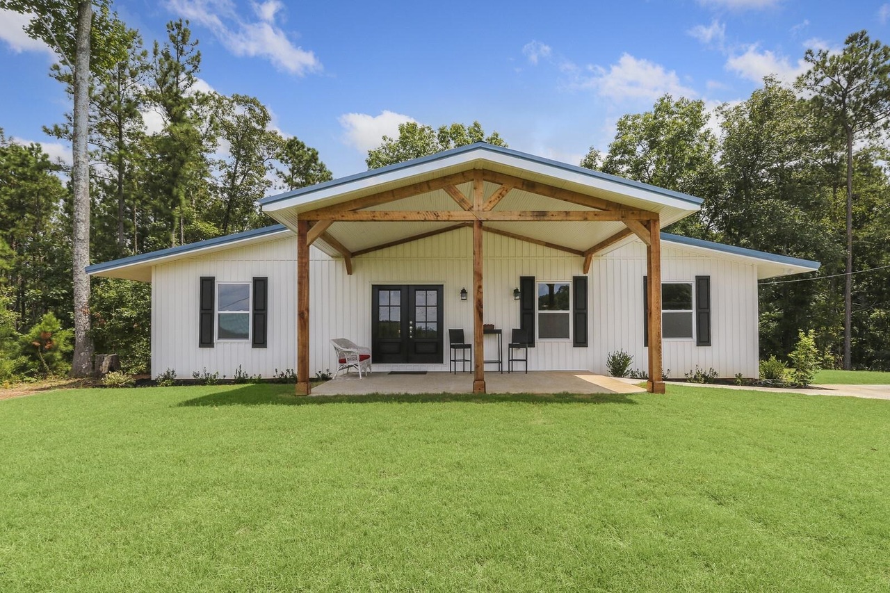 93 Clark Hill Road Newnan, GA 30263 - Photo 1 of 1 a front view of house with yard and outdoor seating