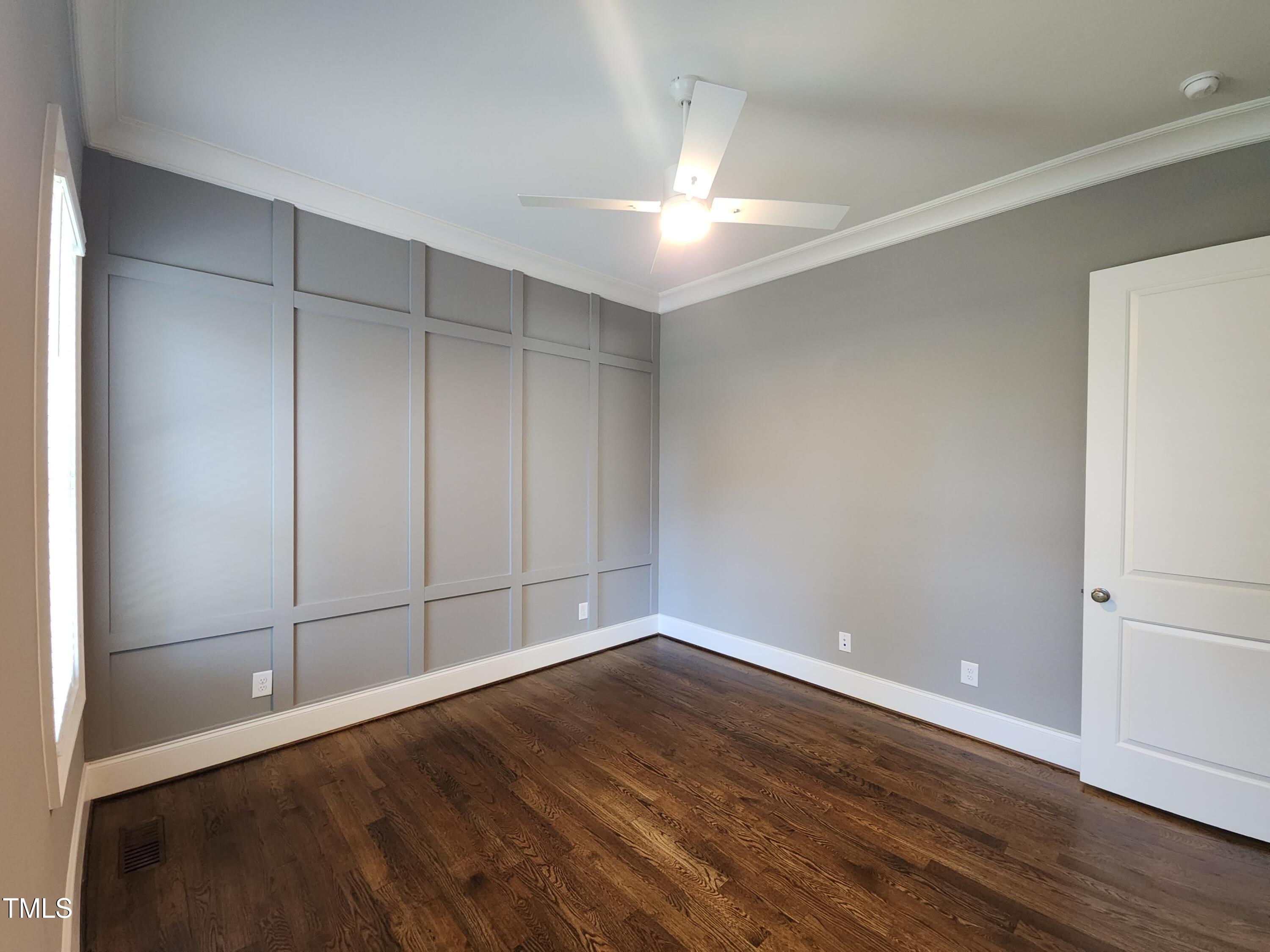 1317 Pecora Lane Raleigh, NC 27607 - Photo 22 of 48 Main floor bedroom with custom accent wall