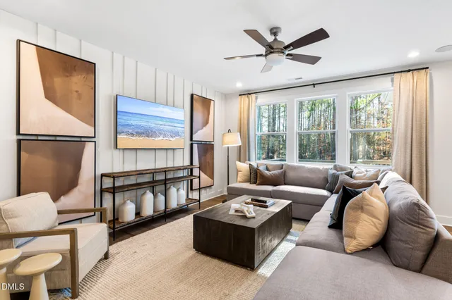 a living room with furniture and a window