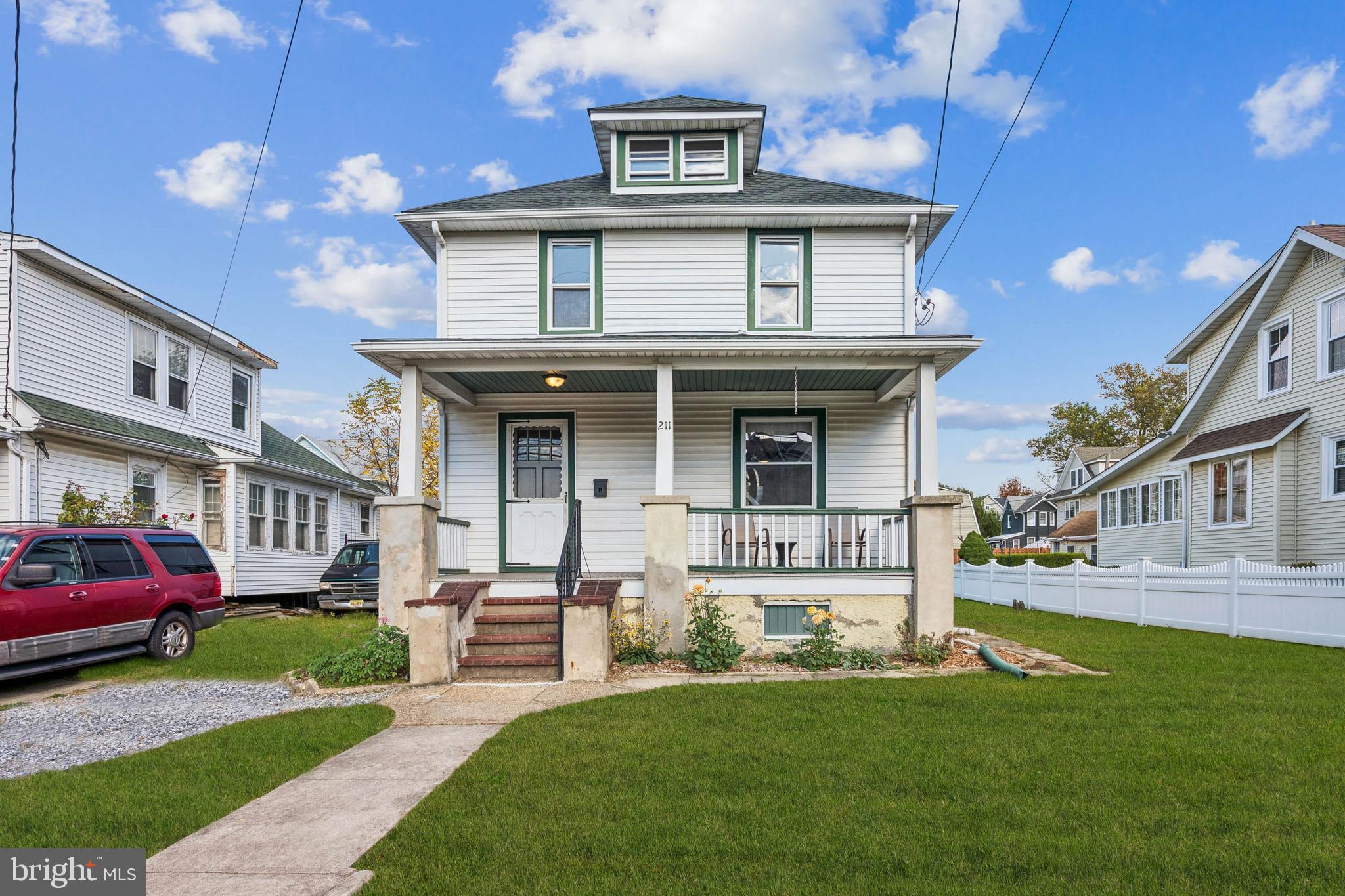 211 Newton Avenue Oaklyn, NJ 08107 - Photo 1 of 25 a view of a building with a yard