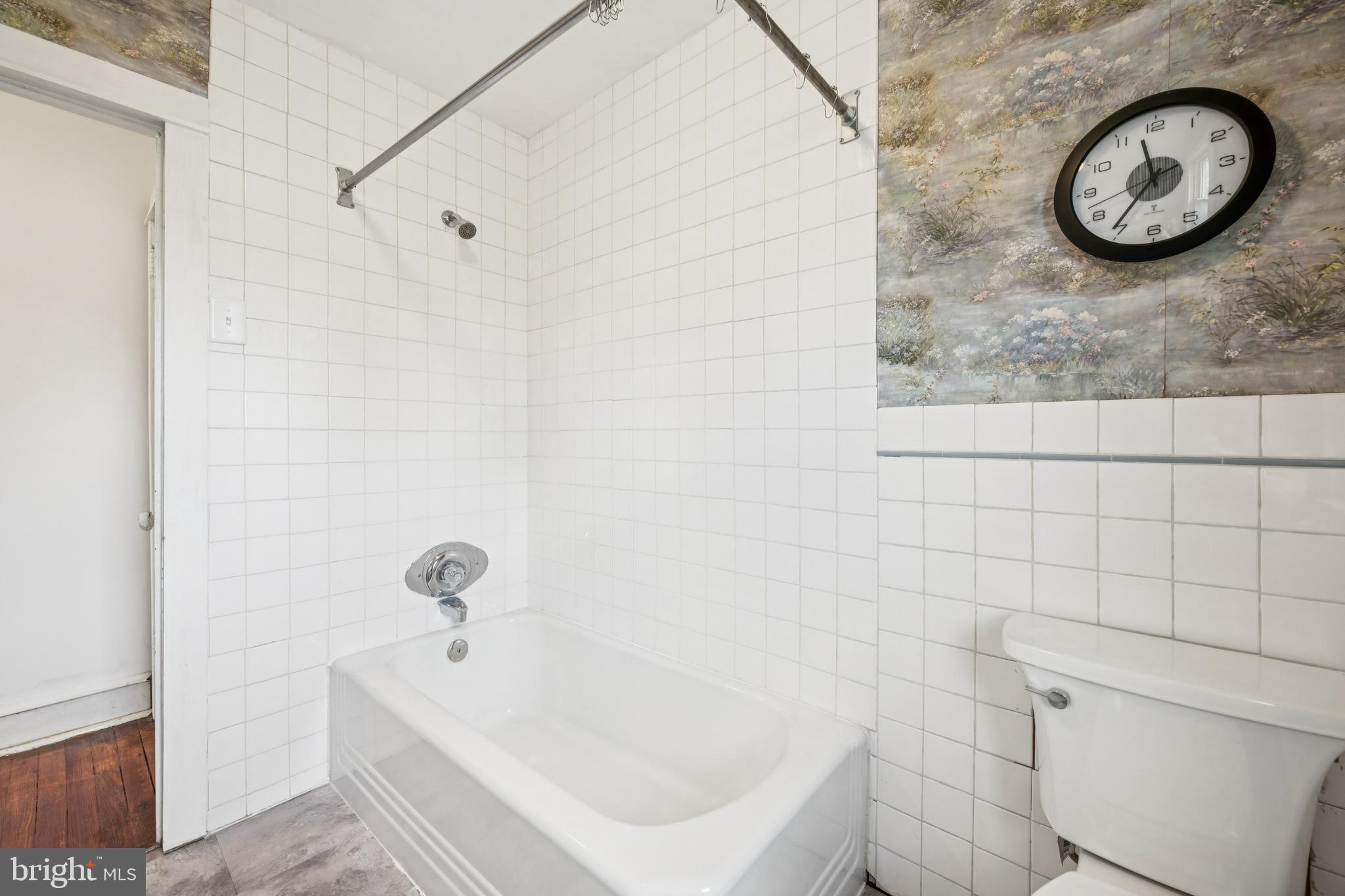 211 Newton Avenue Oaklyn, NJ 08107 - Photo 19 of 25 a bathroom with a tub and a shower