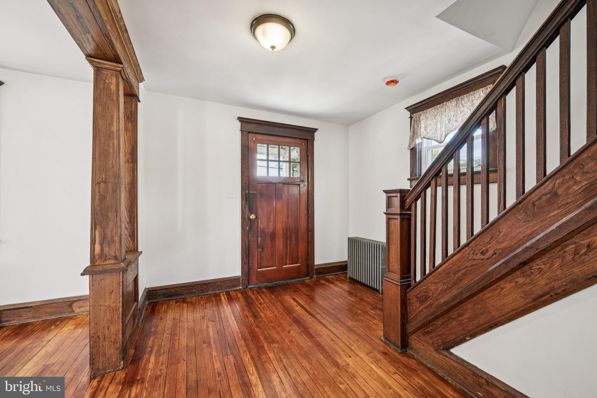 211 Newton Avenue Oaklyn, NJ 08107 - Photo 4 of 25 a view of an entryway with wooden floor and stairs