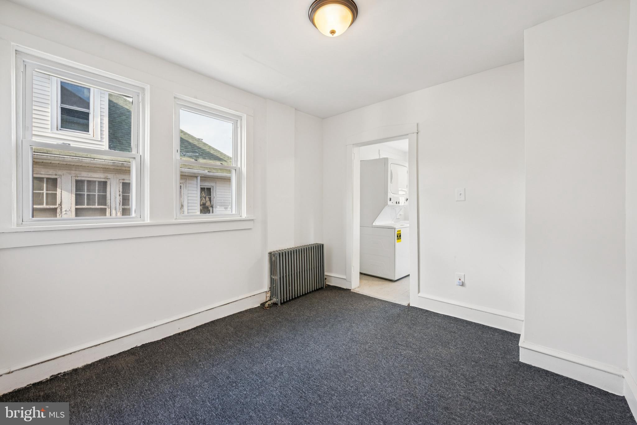 211 Newton Avenue Oaklyn, NJ 08107 - Photo 10 of 25 a view of an empty room with a window