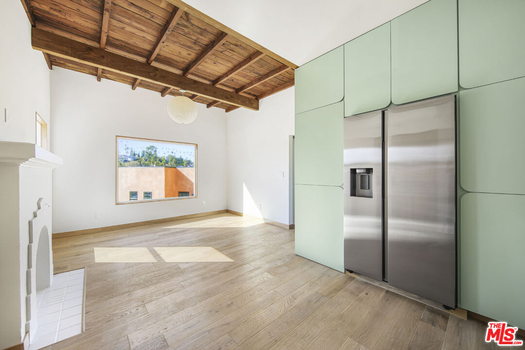 3361 Hamilton Way Los Angeles, CA 90026 - Photo 21 of 25 a view of a refrigerator in kitchen and an empty room