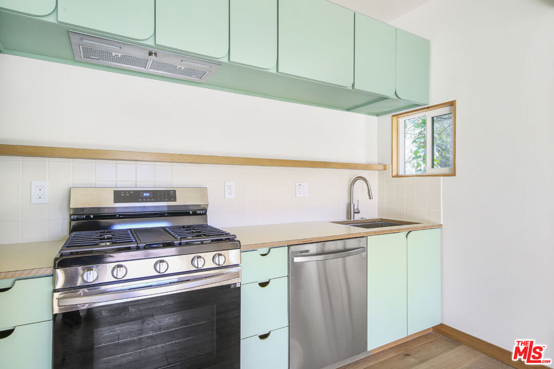 3361 Hamilton Way Los Angeles, CA 90026 - Photo 24 of 25 a white stove top oven sitting inside of a kitchen