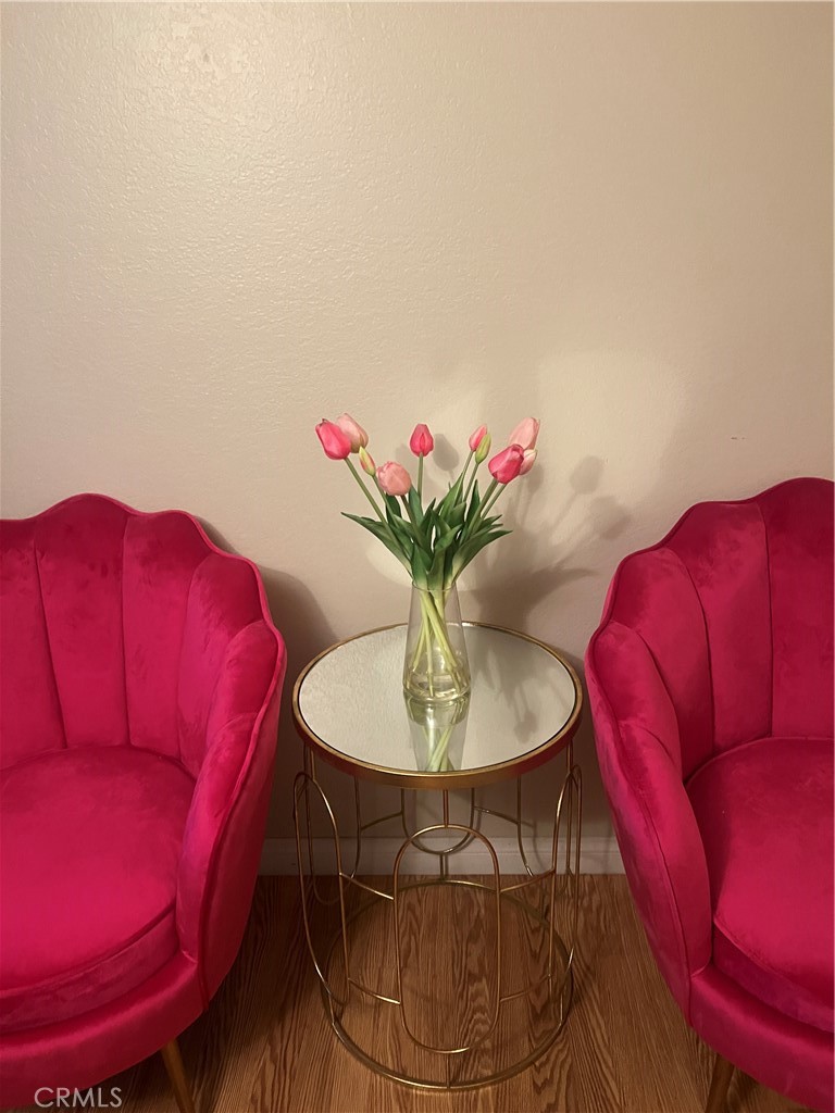 12300 Montecito Road, Unit 24 Seal Beach, CA 90740 - Photo 6 of 8 a flower room with a couch and a potted plant