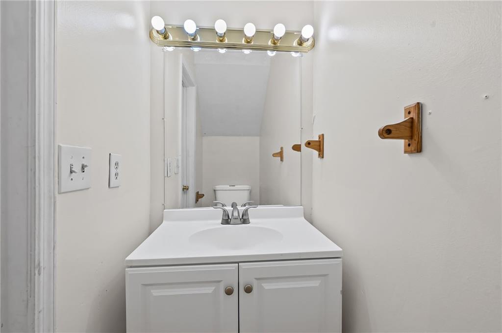 1222 Ridgecrest Lane Southeast Smyrna, GA 30080 - Photo 14 of 27 a bathroom with a sink and a mirror