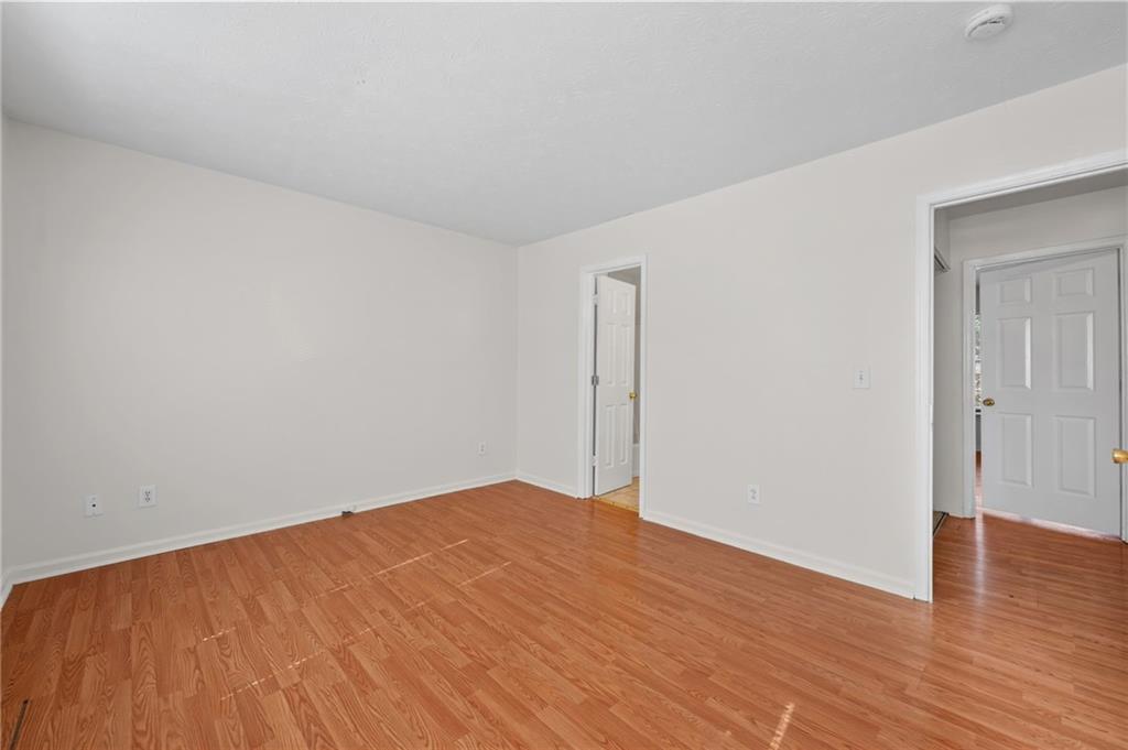 1222 Ridgecrest Lane Southeast Smyrna, GA 30080 - Photo 17 of 27 a view of empty room with wooden floor