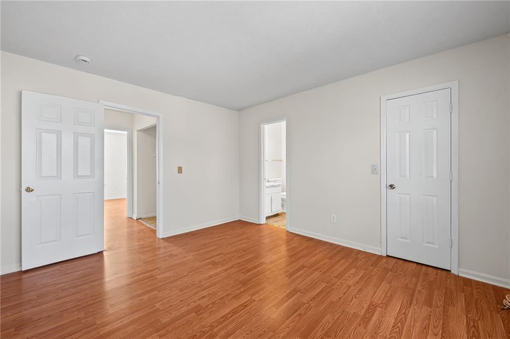 1222 Ridgecrest Lane Southeast Smyrna, GA 30080 - Photo 23 of 27 a view of an empty room with wooden floor