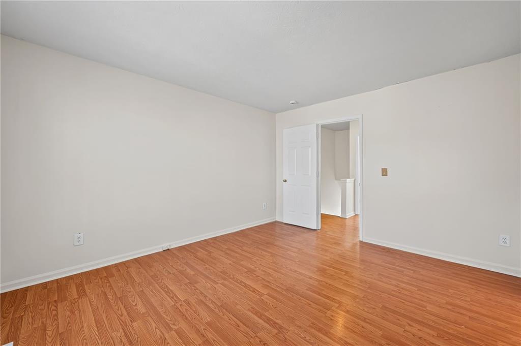 1222 Ridgecrest Lane Southeast Smyrna, GA 30080 - Photo 24 of 27 a view of an empty room with wooden floor