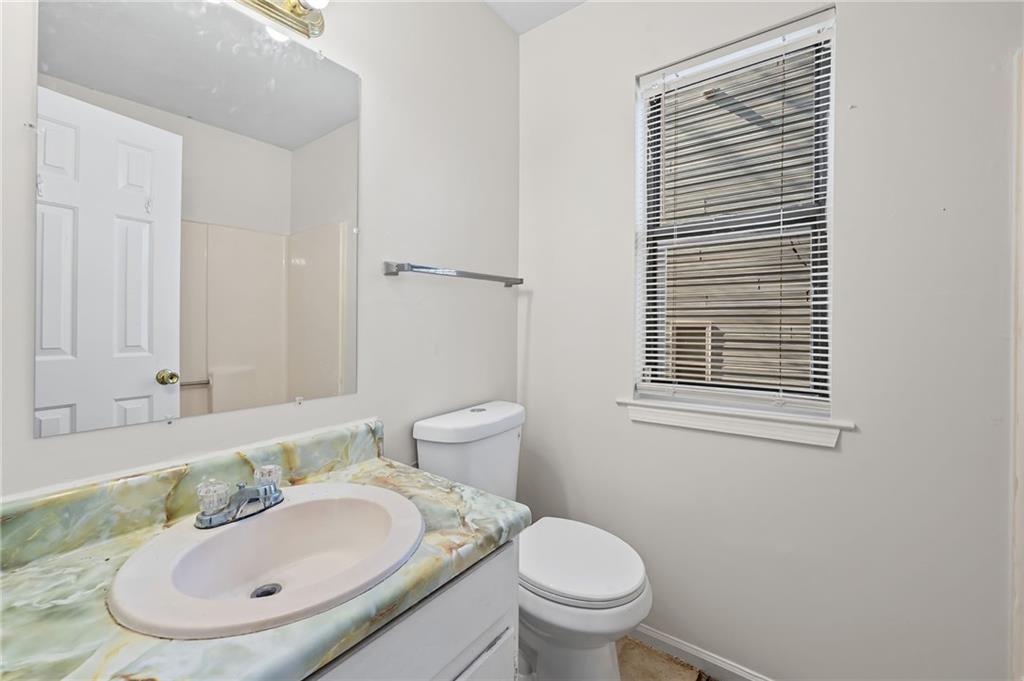 1222 Ridgecrest Lane Southeast Smyrna, GA 30080 - Photo 26 of 27 a bathroom with a sink and a toilet