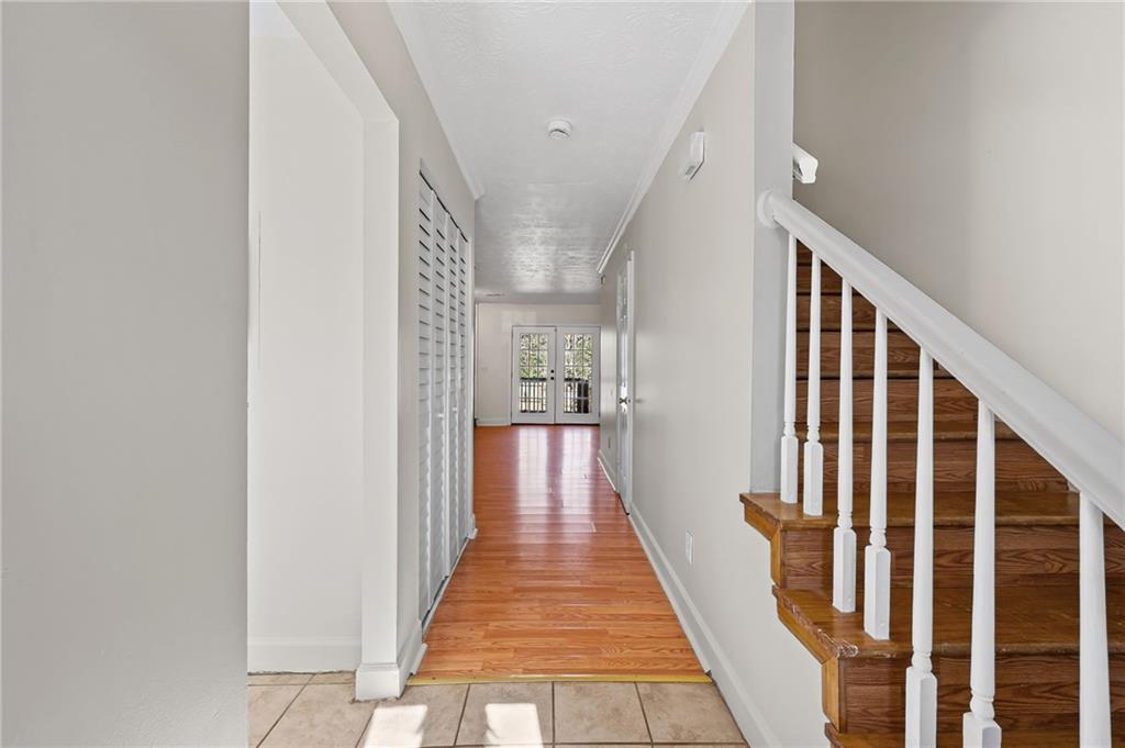 1222 Ridgecrest Lane Southeast Smyrna, GA 30080 - Photo 4 of 27 a view of a hallway with wooden floor and staircase