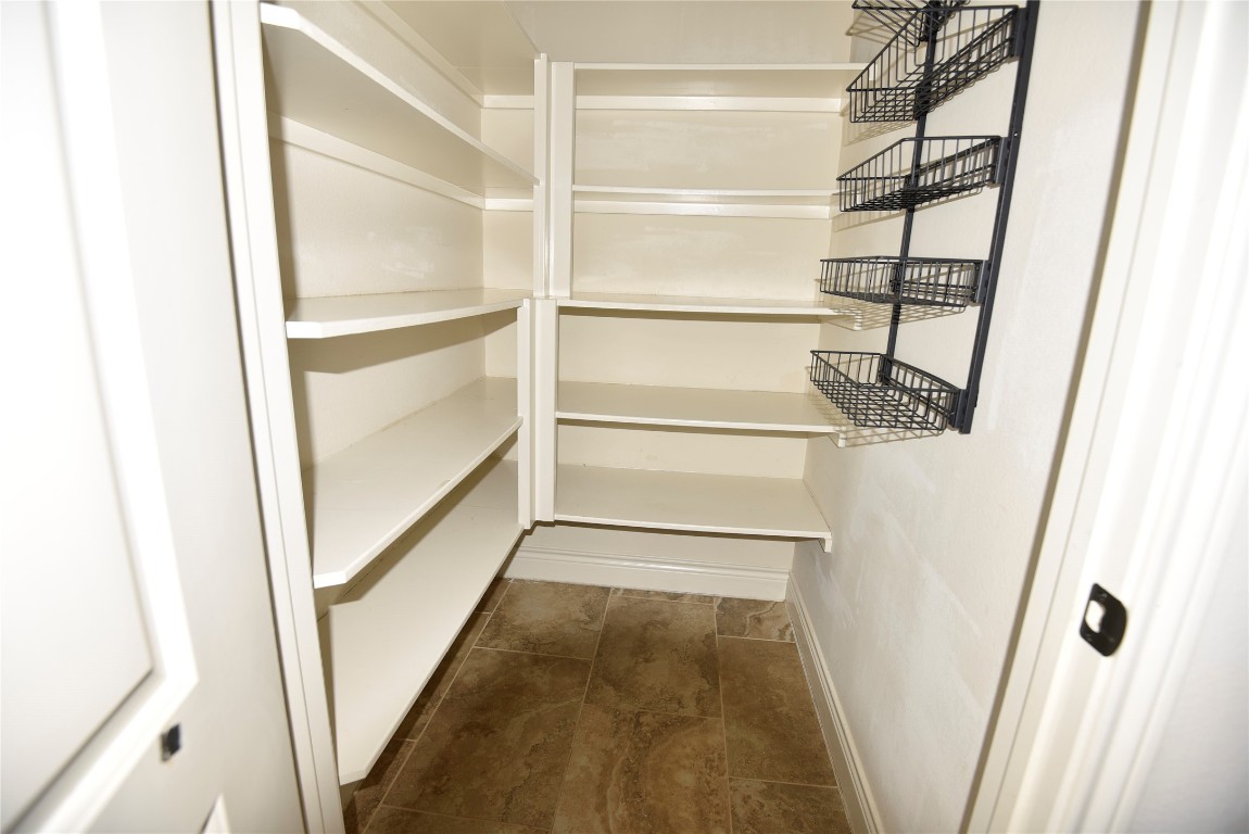 18610 Lena Trail Drive Spring, TX 77388 - Photo 13 of 47 a view of walk in closet with empty racks