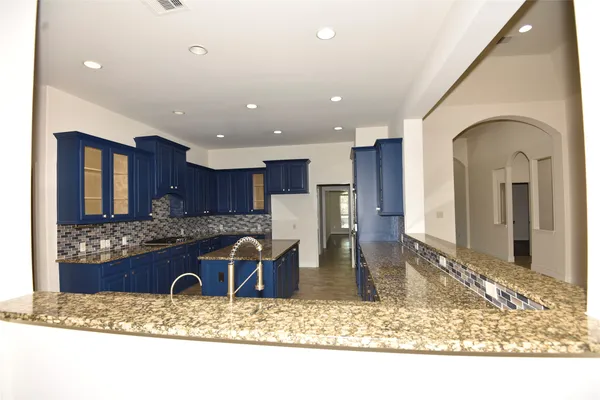 a view of a living room and kitchen