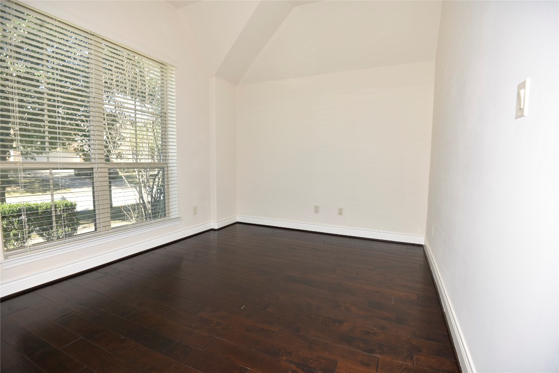 18610 Lena Trail Drive Spring, TX 77388 - Photo 21 of 47 an empty room with wooden floor and windows