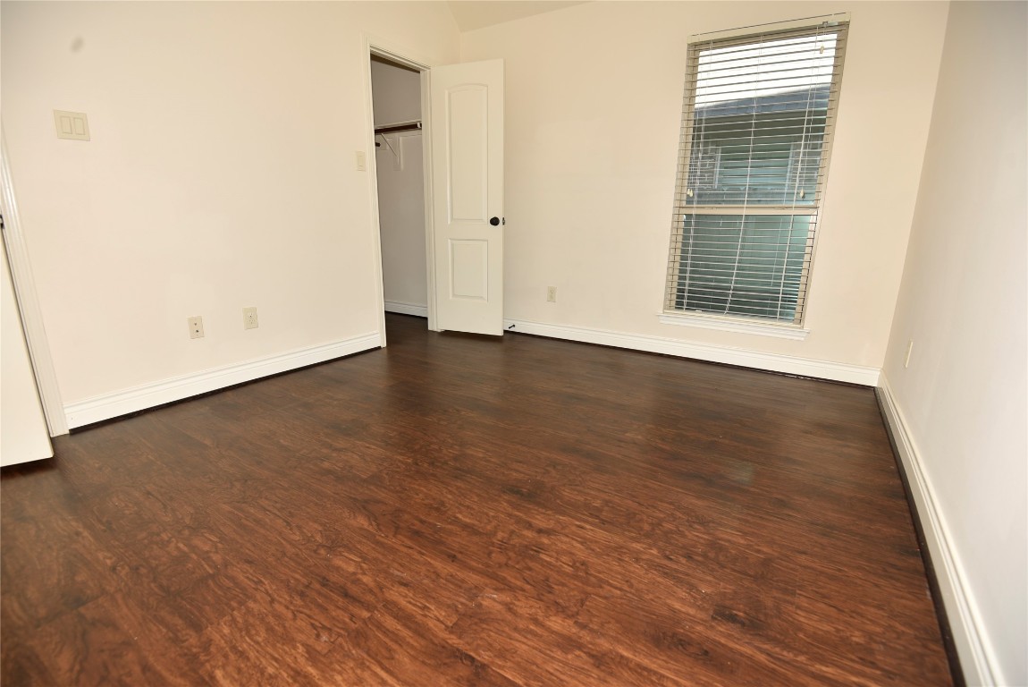18610 Lena Trail Drive Spring, TX 77388 - Photo 28 of 47 a view of an empty room with wooden floor and a window