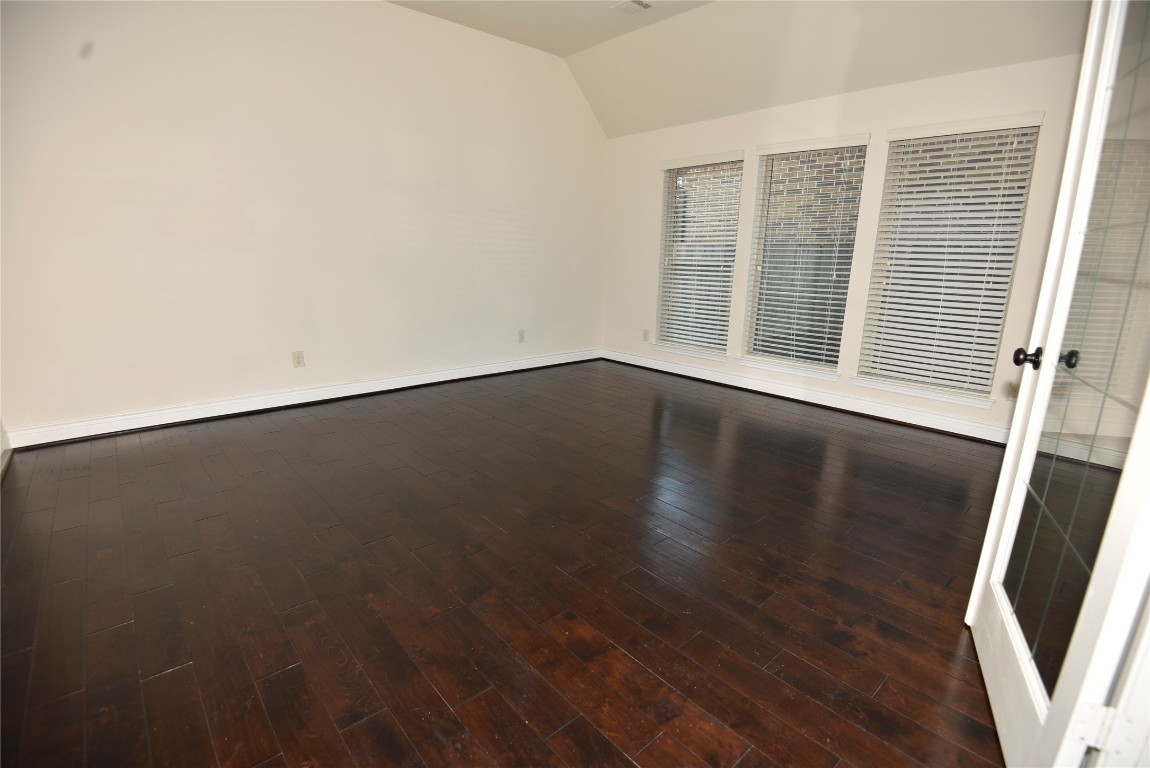 18610 Lena Trail Drive Spring, TX 77388 - Photo 33 of 47 an empty room with wooden floor and windows