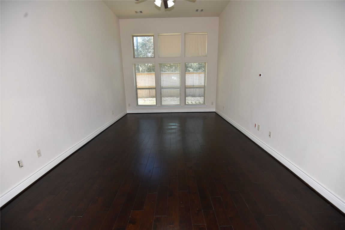18610 Lena Trail Drive Spring, TX 77388 - Photo 39 of 47 an empty room with wooden floor and windows