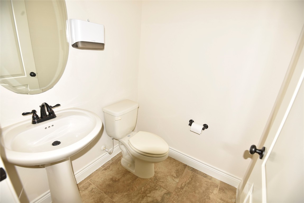 18610 Lena Trail Drive Spring, TX 77388 - Photo 9 of 47 a bathroom with a sink and a mirror