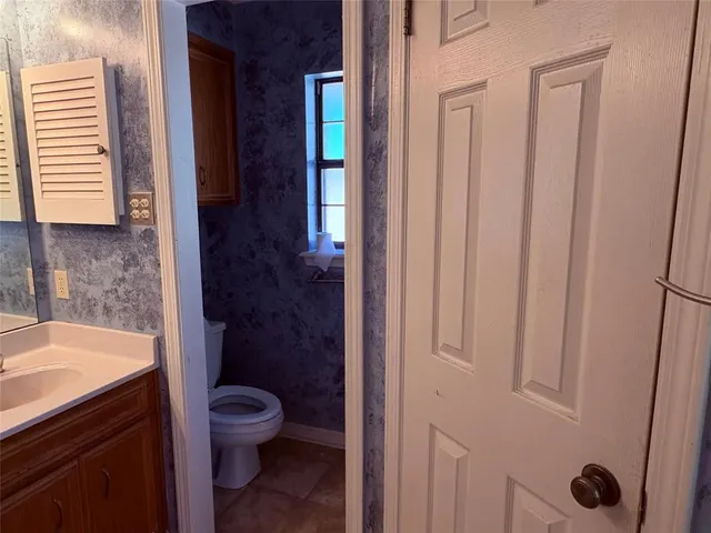 an empty room with wooden floor