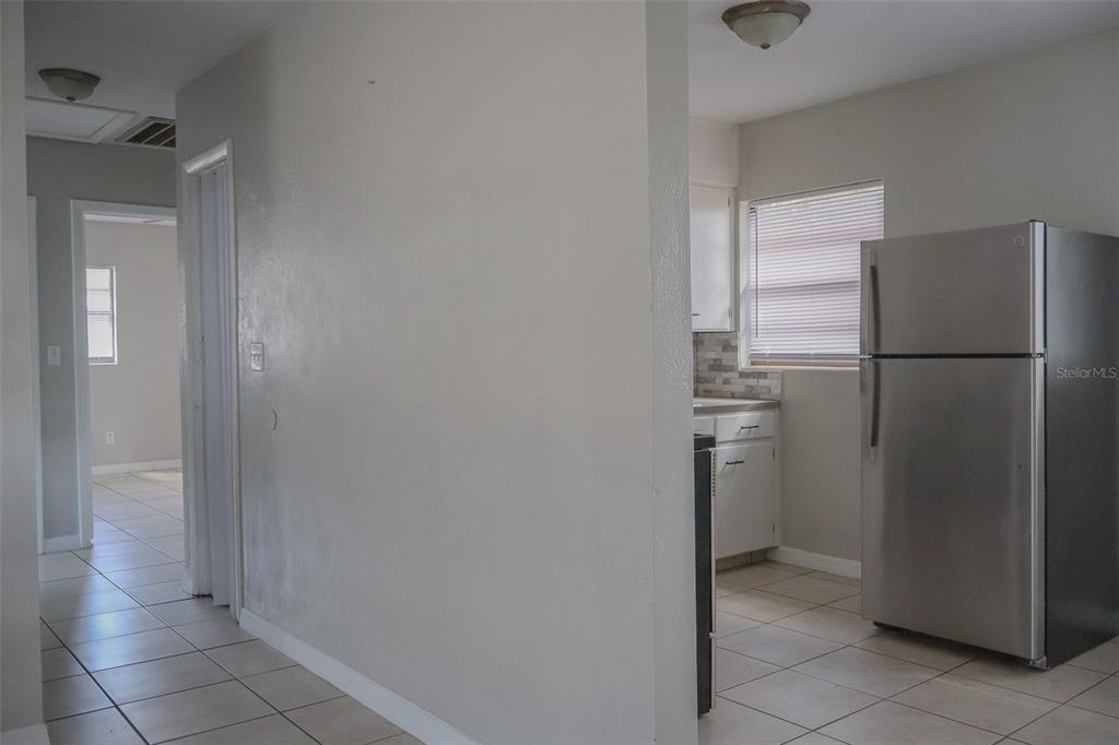 2708 Dixie Road Lakeland, FL 33801 - Photo 6 of 31 a view of a kitchen with a refrigerator a sink and dishwasher