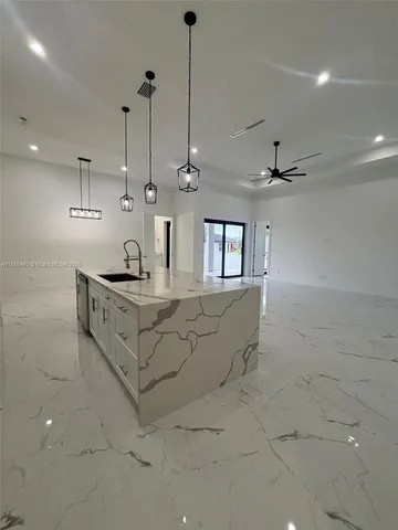 a bathroom with a sink a vanity and a mirror