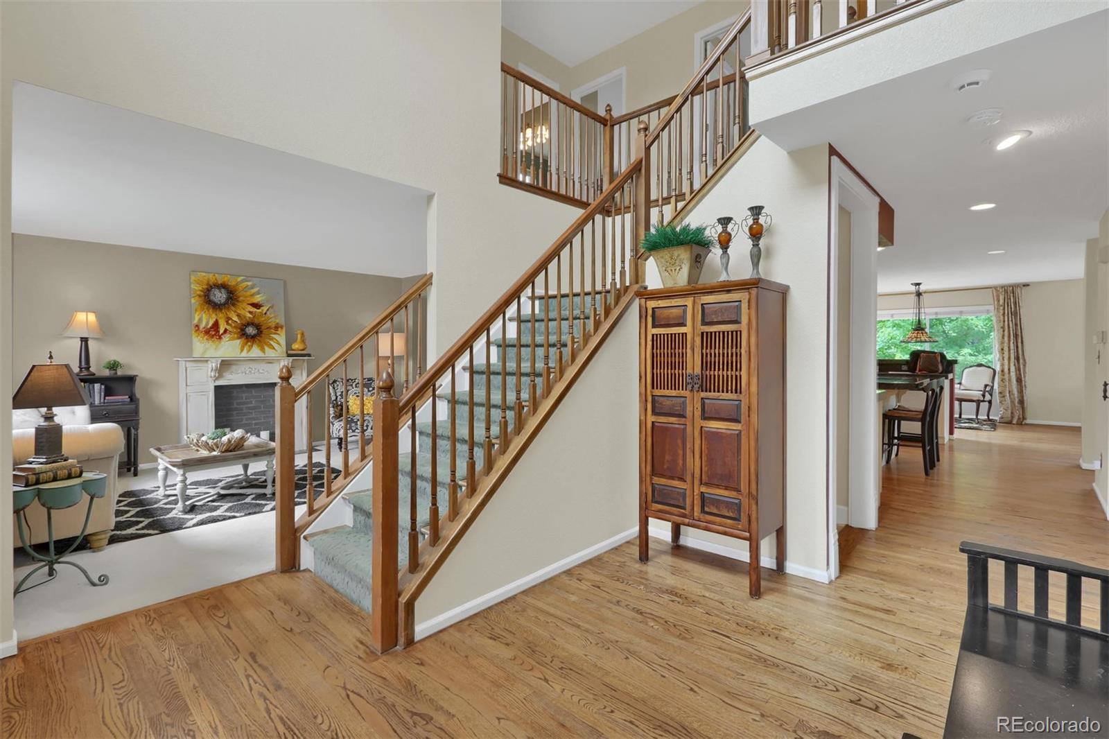 10115 Spring Water Court Highlands Ranch, CO 80129 - Photo 2 of 35 a view of entryway and hall with wooden floor