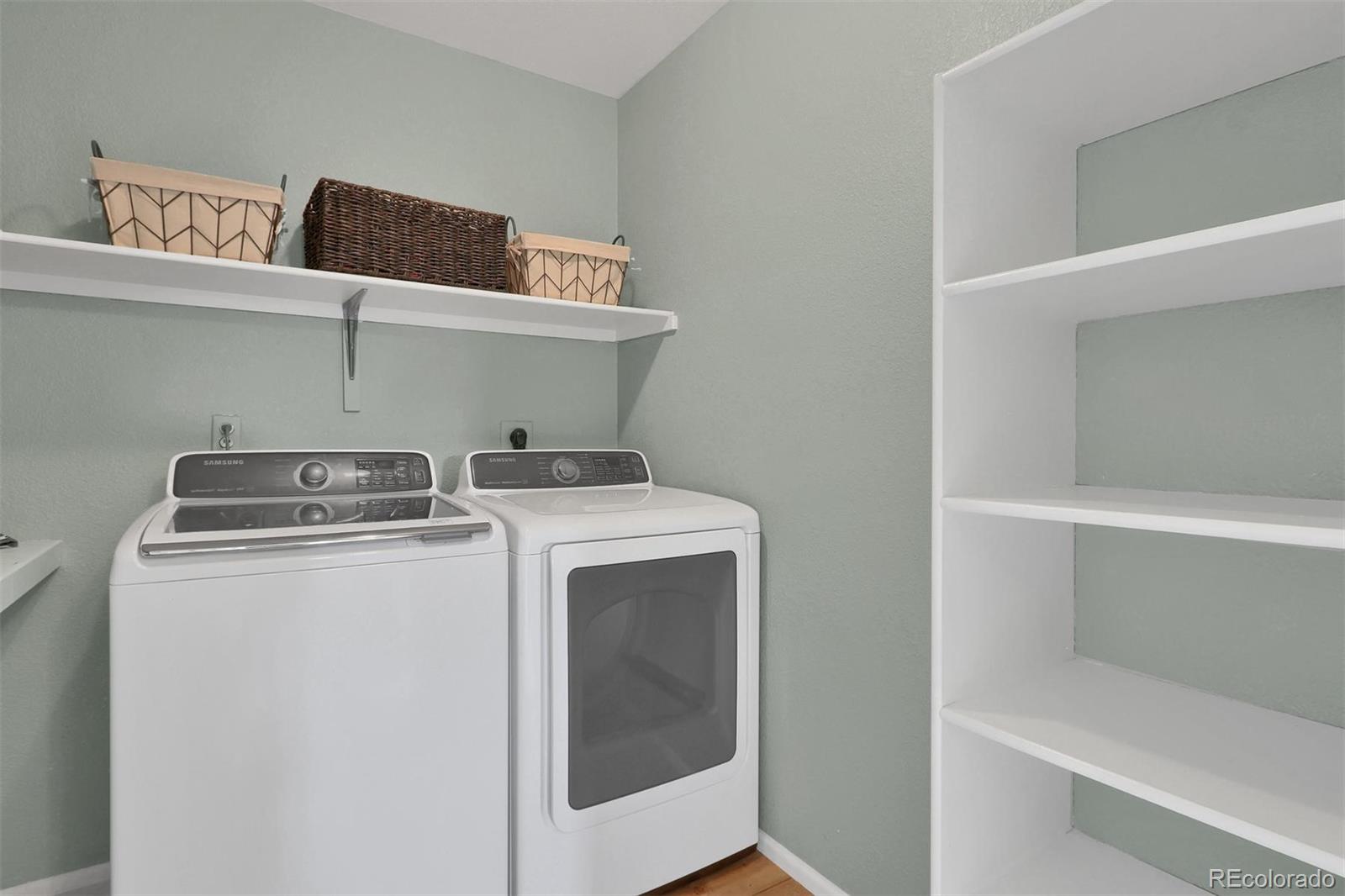 10115 Spring Water Court Highlands Ranch, CO 80129 - Photo 24 of 35 a utility room with dryer and washer