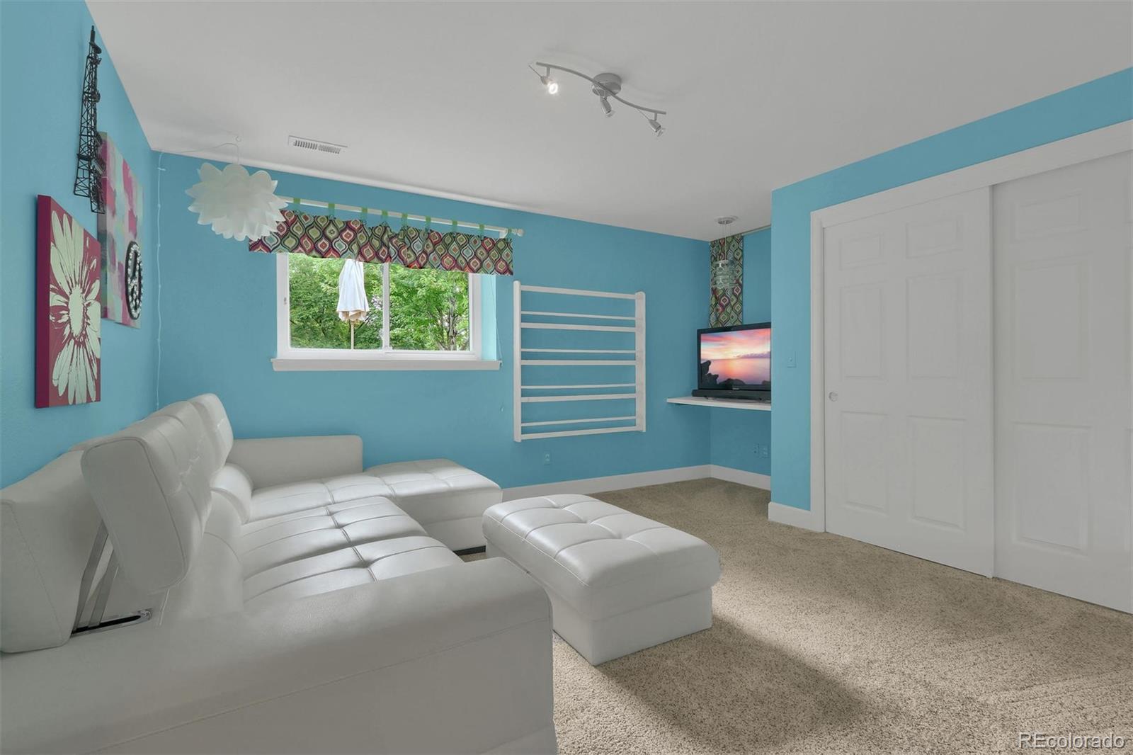 10115 Spring Water Court Highlands Ranch, CO 80129 - Photo 30 of 35 a bedroom with a bed and a couch