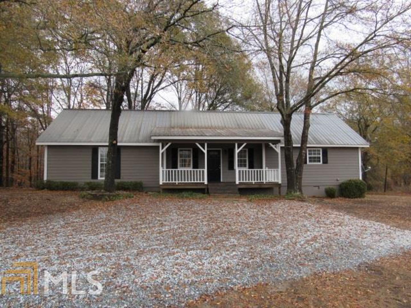 746 Wrights Mill Road Commerce, GA 30530 - Photo 1 of 1 a front view of a house with a garden