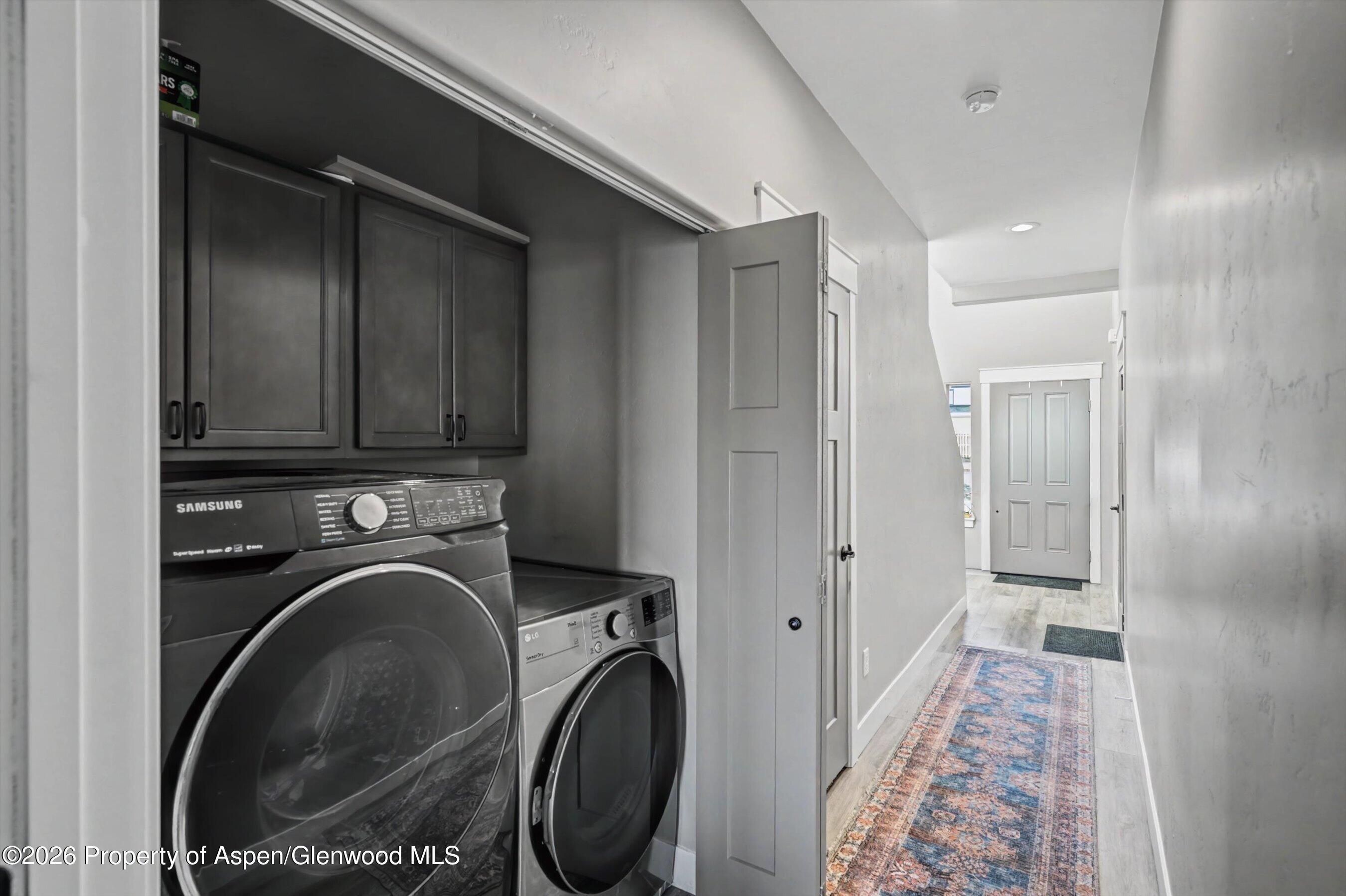 157 Willow Circle Rifle, CO 81650 - Photo 15 of 18 a view of a hallway with washer and dryer