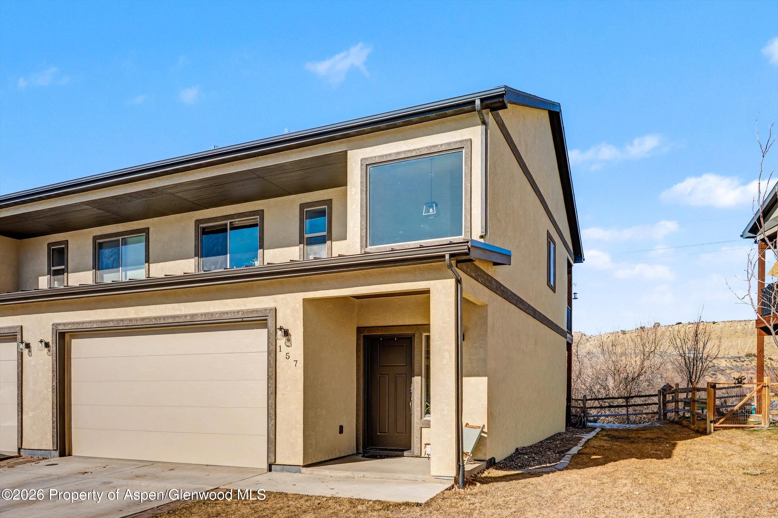 157 Willow Circle Rifle, CO 81650 - Photo 2 of 18 a view of a house with a wooden fence