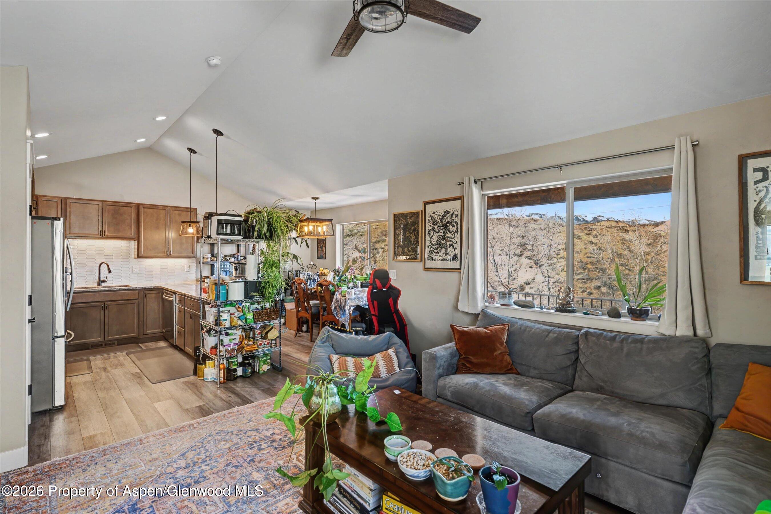 157 Willow Circle Rifle, CO 81650 - Photo 6 of 18 a living room with furniture and a large window
