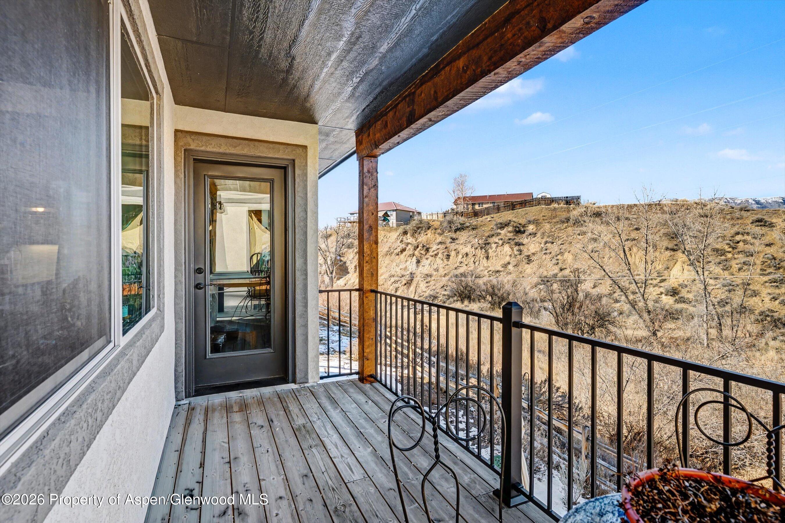 157 Willow Circle Rifle, CO 81650 - Photo 8 of 18 a view of balcony with wooden floor