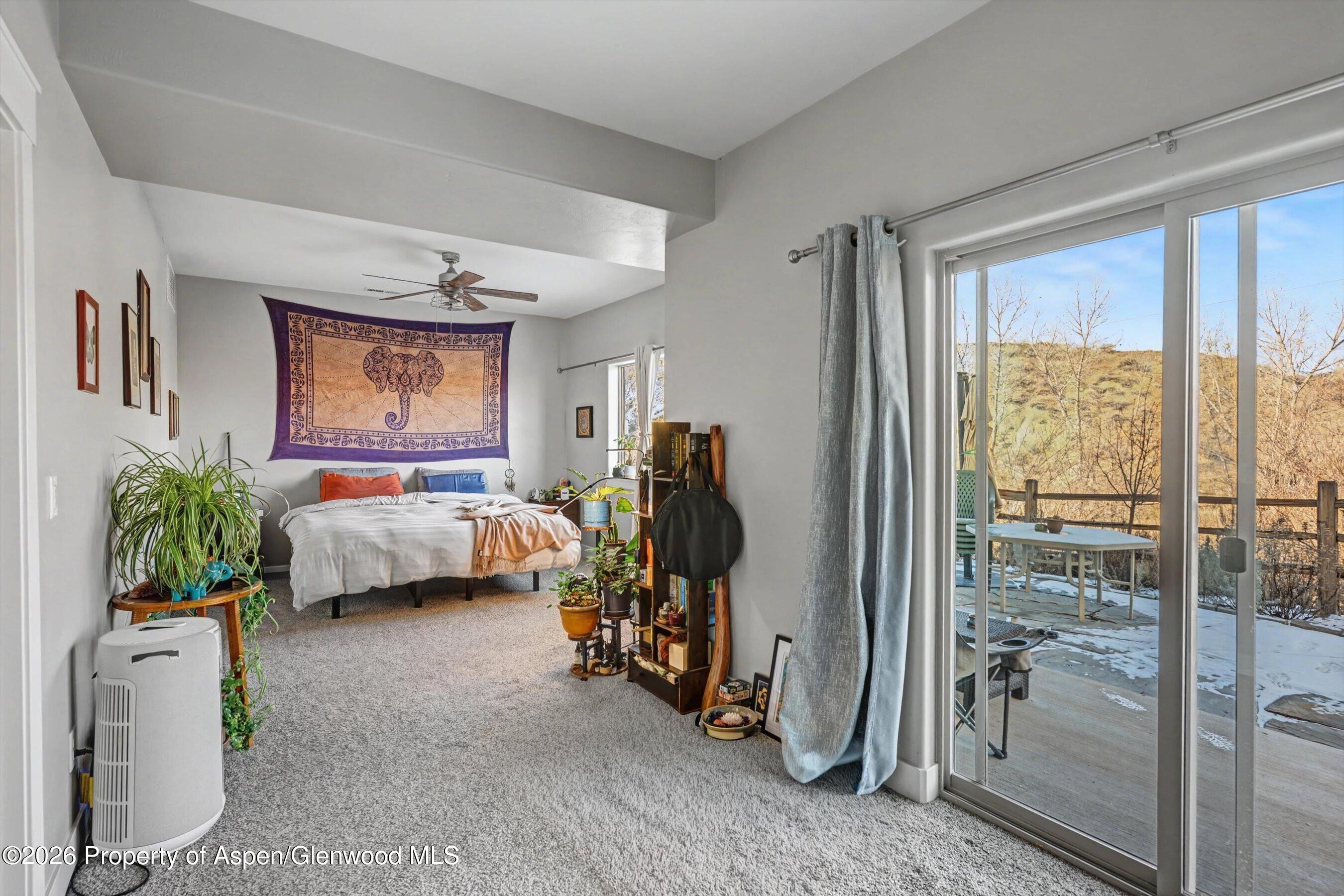 157 Willow Circle Rifle, CO 81650 - Photo 10 of 18 a bedroom with furniture and a window