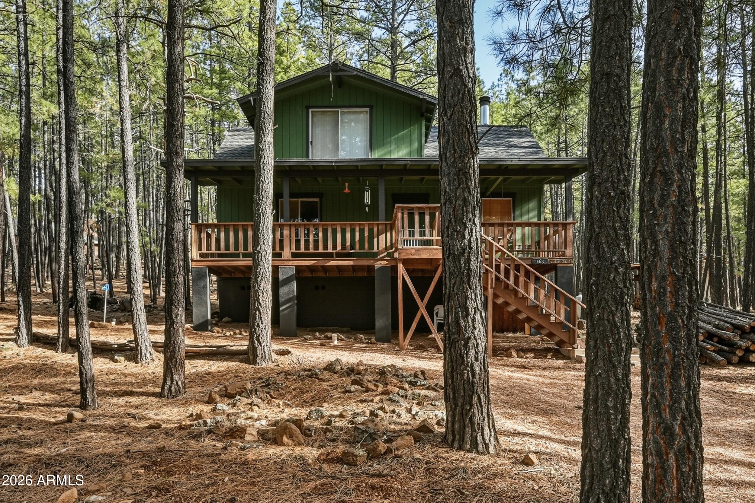 463 Long Valley Road Happy Jack, AZ 86024 - Photo 20 of 25 a front view of a house with street