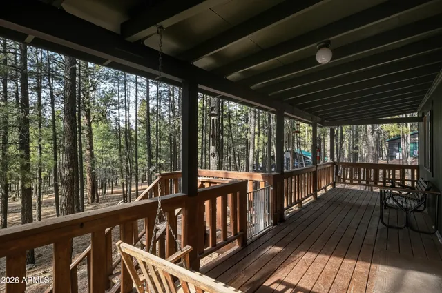 a view of two chairs in the balcony