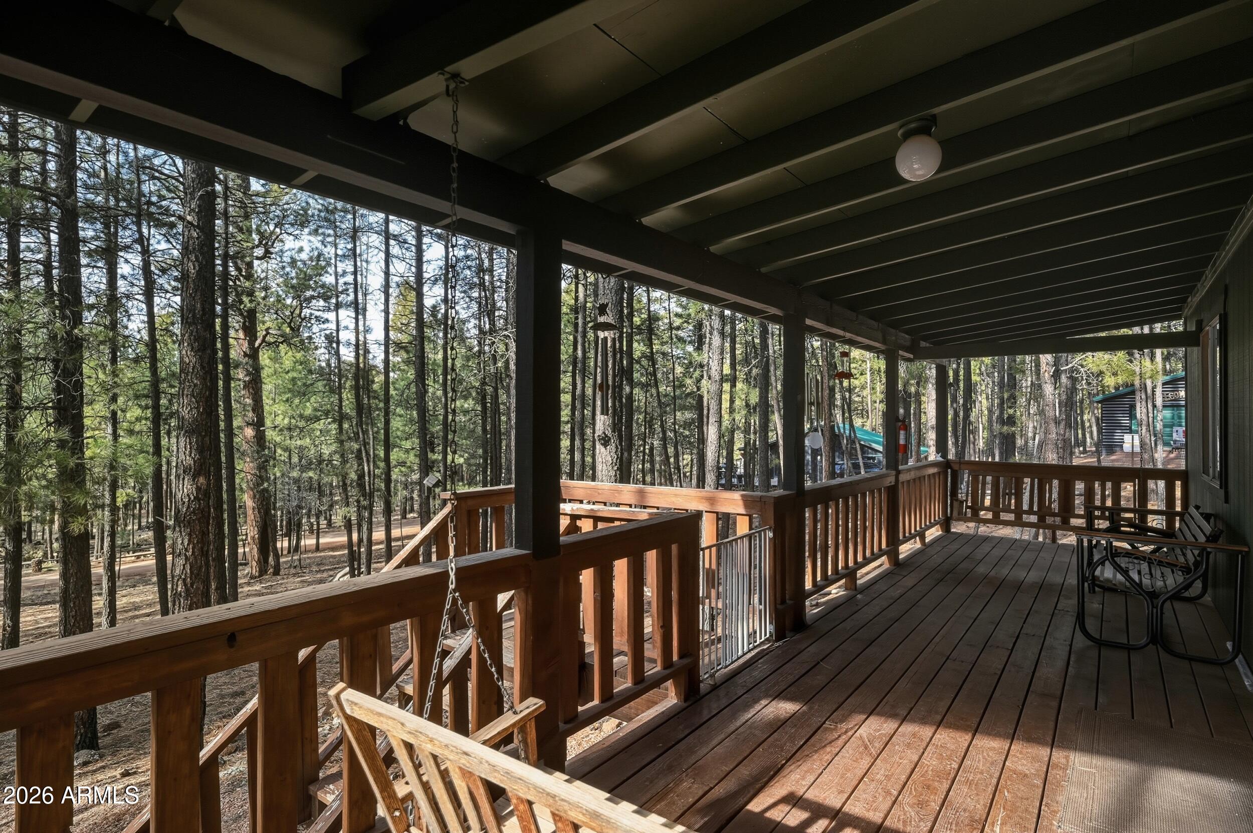 463 Long Valley Road Happy Jack, AZ 86024 - Photo 3 of 25 a view of two chairs in the balcony