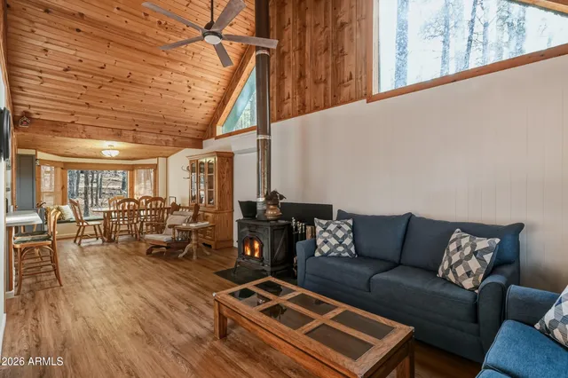 a living room with furniture a couch and wooden floor