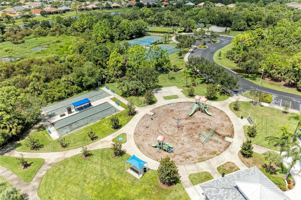 12642 Harney Street Venice, FL 34293 - Photo 64 of 85 an aerial view of a house with a swimming pool